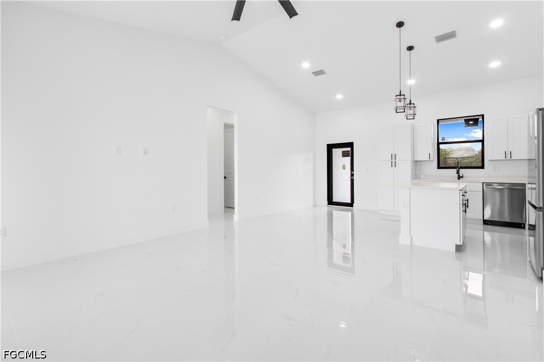 3004 South Tulip Road LaBelle, FL 33935 - Photo 8 of 24 a view of a living room a window and a kitchen view