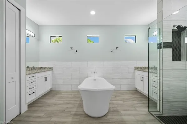 a bathroom with a sink and mirror