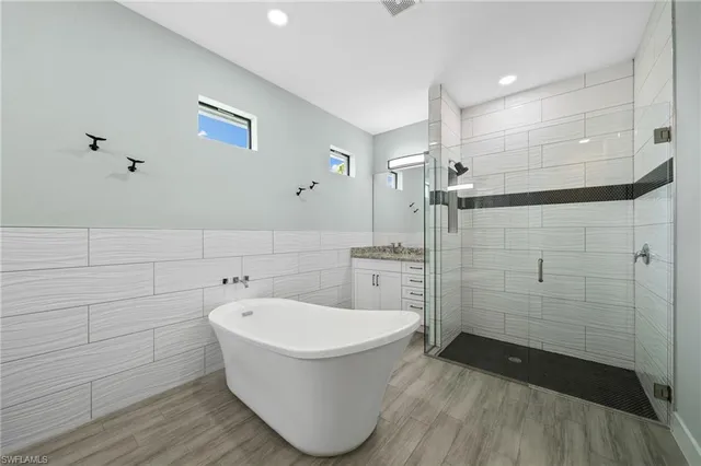 a bathroom with a sink and shower
