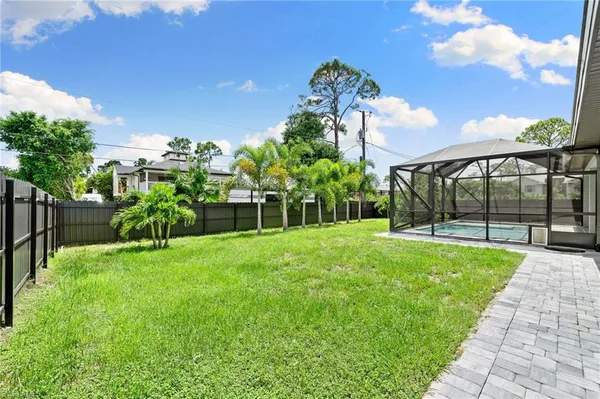 a view of a garden with a building in the background