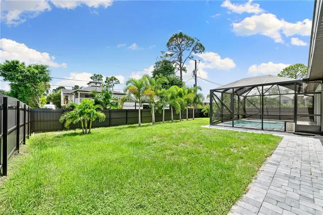 a view of a garden with a building in the background
