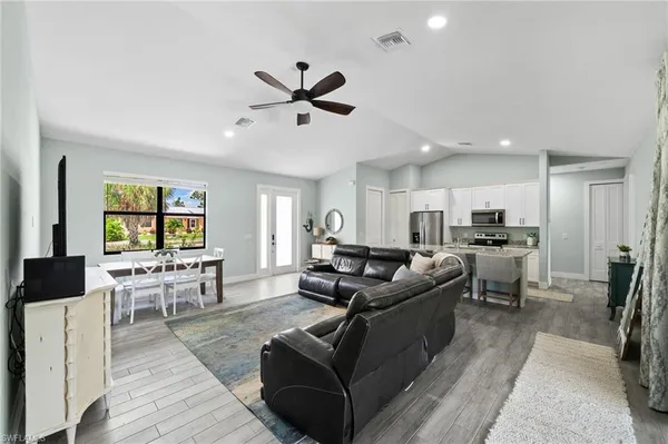 a living room with furniture and a large window