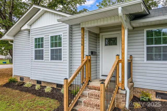 a view of a house with wooden stairs