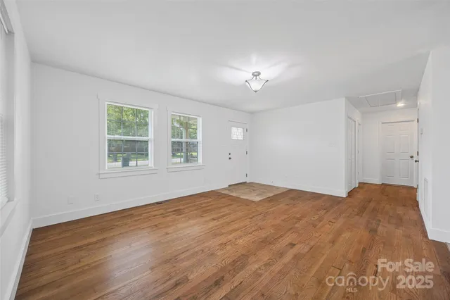 a view of empty room with windows