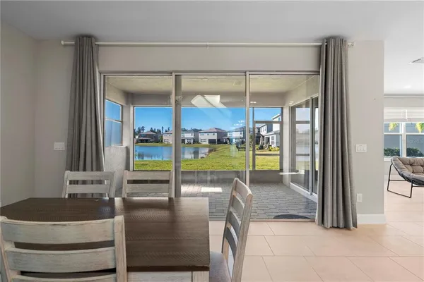 a view of a living room and floor to ceiling window