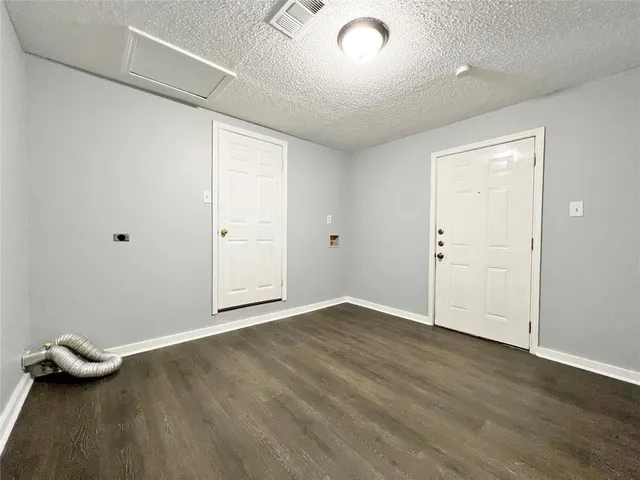 an empty room with wooden floor