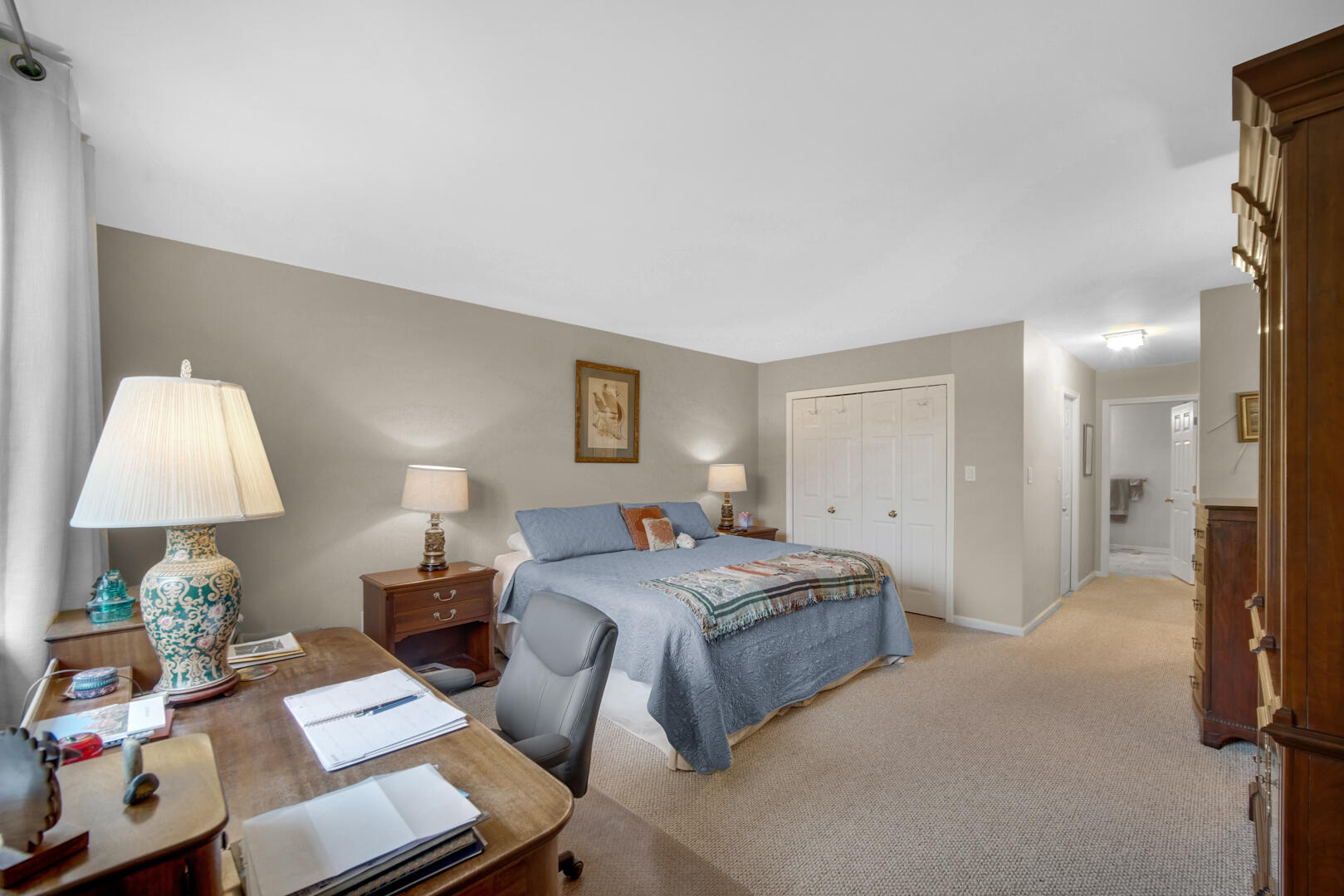 910 Ridge Road, Unit 405 Munster, IN 46321 - Photo 16 of 37 a spacious bedroom with a bed and a lamp