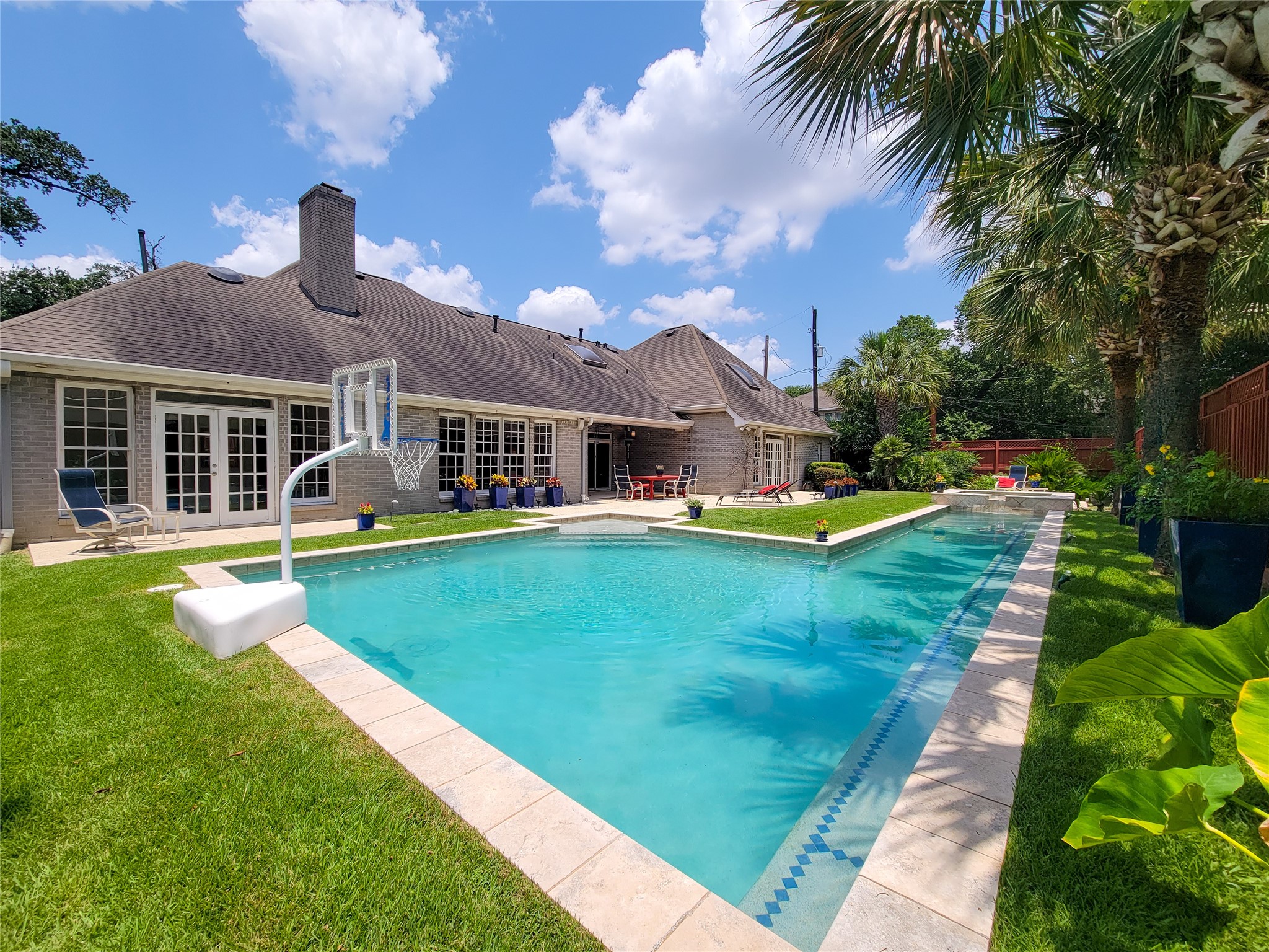 4401 Roseland Street Houston, TX 77006 - Photo 2 of 46 HUGE SALINE POOL CONNECTS TO A LAP POOL...THEN JUMP INTO YOUR HEATED SPA!!! THIS IS A TRUE TROPICAL OASIS AND A HOME DESIGNED FOR FUN AND ENTERTAINMENT!!!