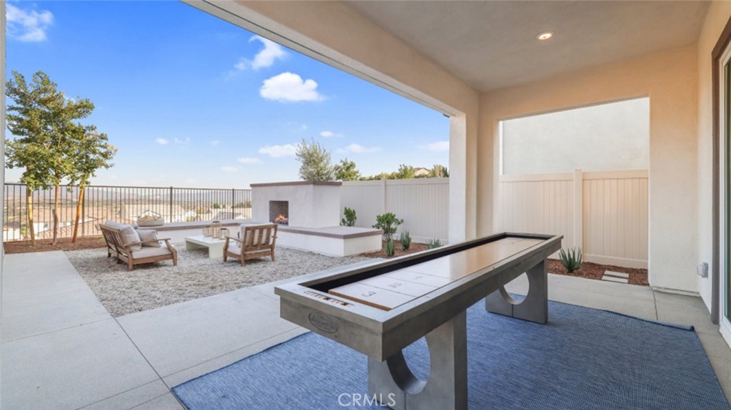 29602 Paseo Tranquilo Valencia, CA 91354 - Photo 13 of 43 a living room with furniture a rug and a potted plant