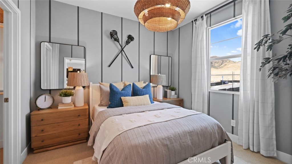 29602 Paseo Tranquilo Valencia, CA 91354 - Photo 26 of 43 a bedroom with a bed and a chandelier