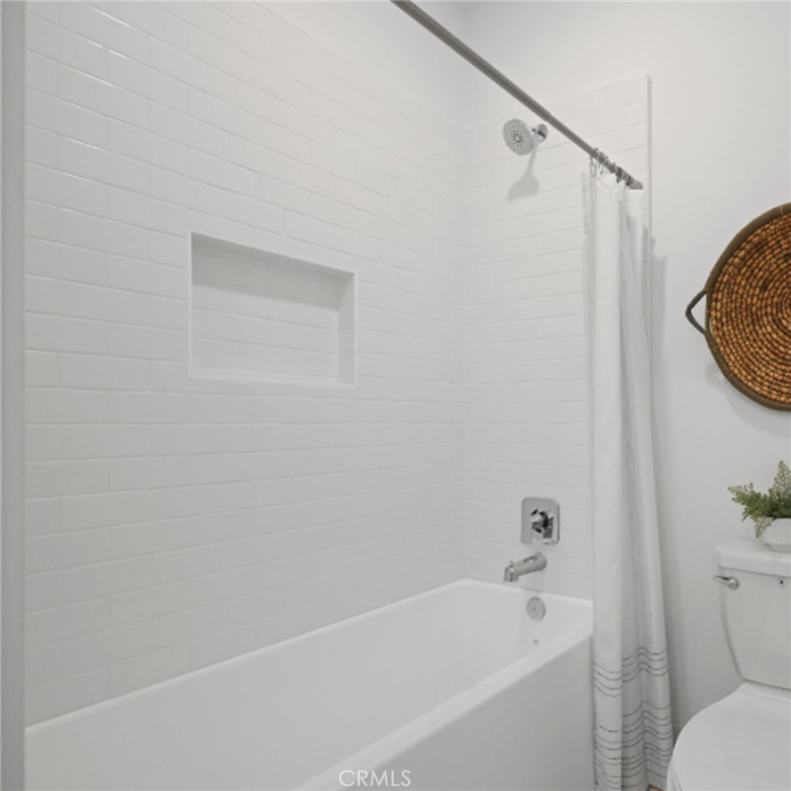 29602 Paseo Tranquilo Valencia, CA 91354 - Photo 29 of 43 a white bath tub sitting next to a white toilet and vanity