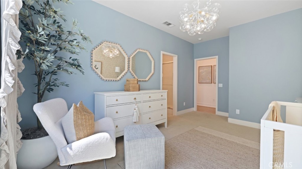 29602 Paseo Tranquilo Valencia, CA 91354 - Photo 35 of 43 a living room with furniture a mirror and a fan