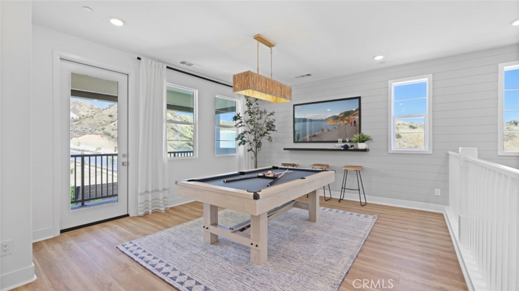 29602 Paseo Tranquilo Valencia, CA 91354 - Photo 37 of 43 a living room with furniture a window and a table