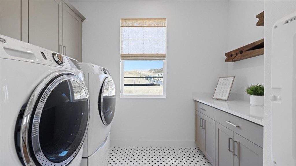 29602 Paseo Tranquilo Valencia, CA 91354 - Photo 38 of 43 a utility room with sink dryer and washer