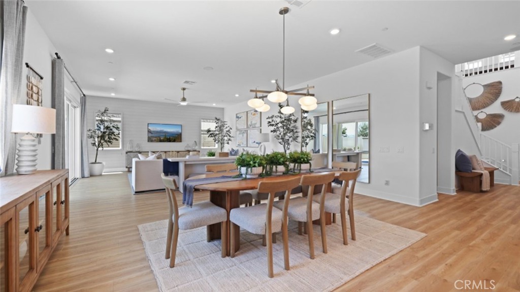 29602 Paseo Tranquilo Valencia, CA 91354 - Photo 9 of 43 a view of a dining room with furniture window and wooden floor