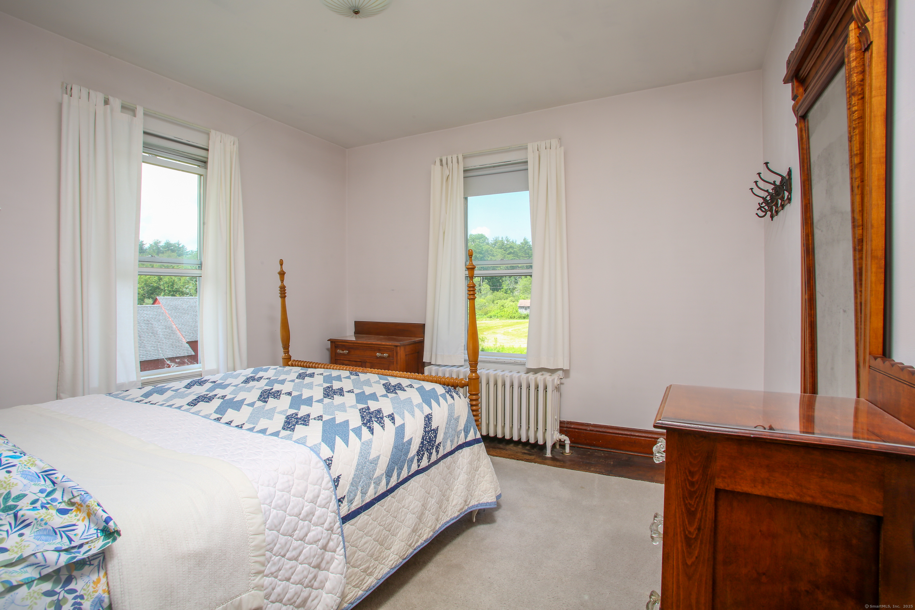 31 Sunset Ridge Road Norfolk, CT 06058 - Photo 15 of 33 a bedroom with a bed and a window