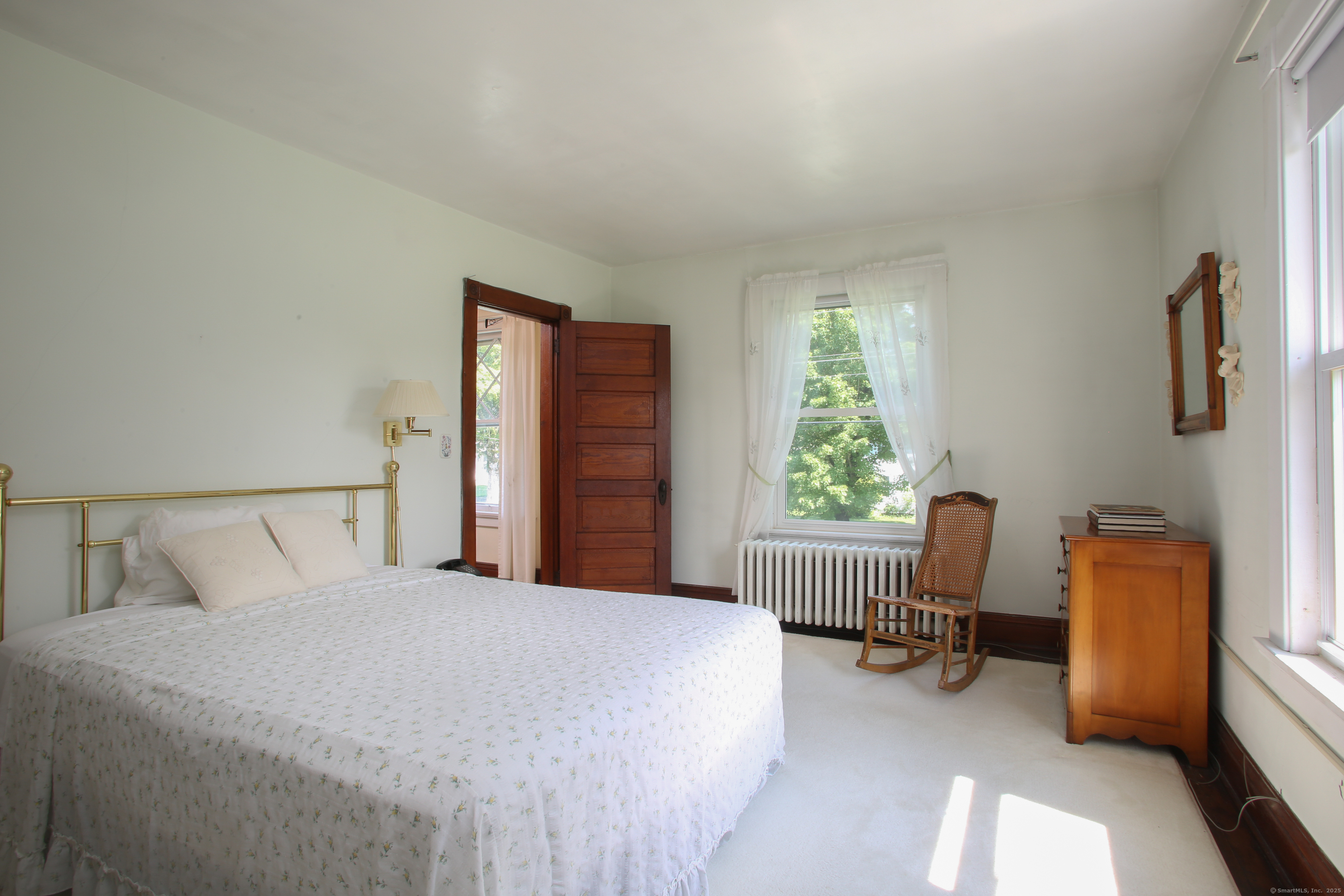 31 Sunset Ridge Road Norfolk, CT 06058 - Photo 16 of 33 a bedroom with a bed and a chair