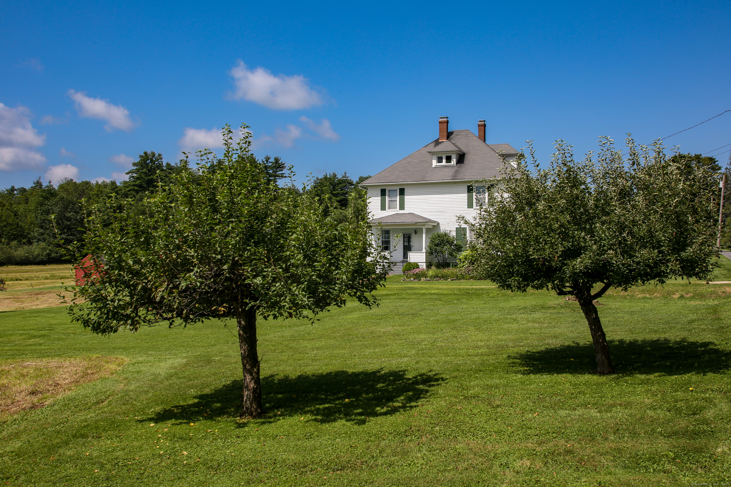 31 Sunset Ridge Road Norfolk, CT 06058 - Photo 26 of 33 a front view of a house with a yard