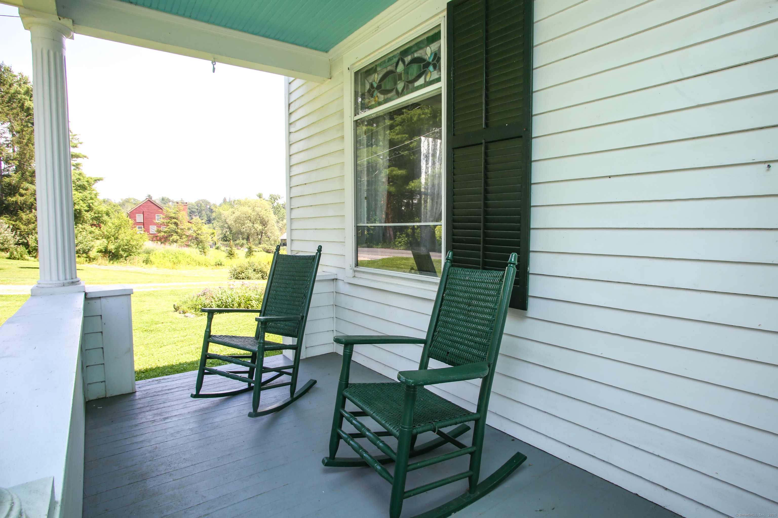 31 Sunset Ridge Road Norfolk, CT 06058 - Photo 27 of 33 a view of a chairs with a table in balcony