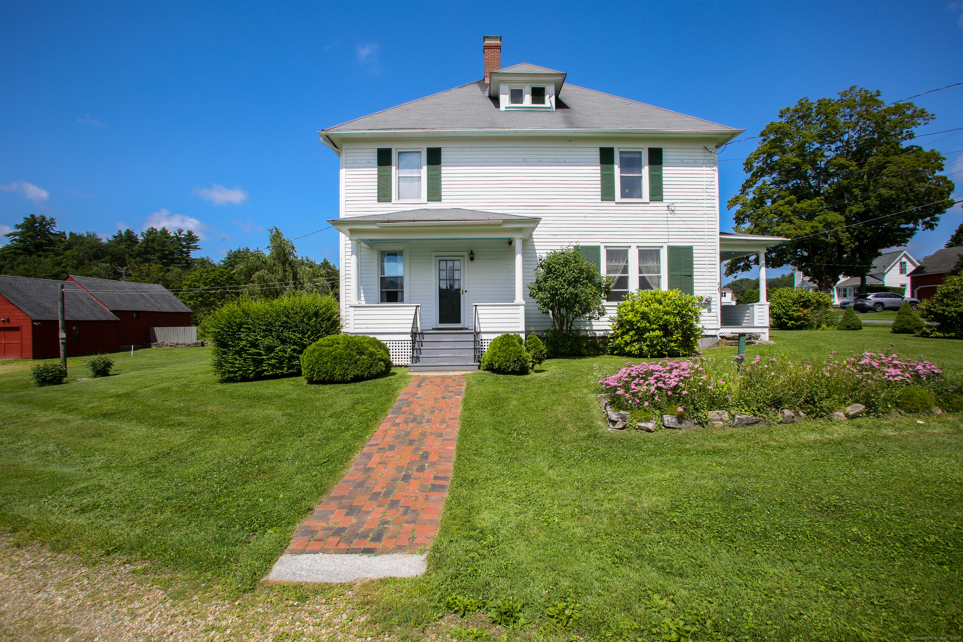 31 Sunset Ridge Road Norfolk, CT 06058 - Photo 29 of 33 a front view of a house with a yard