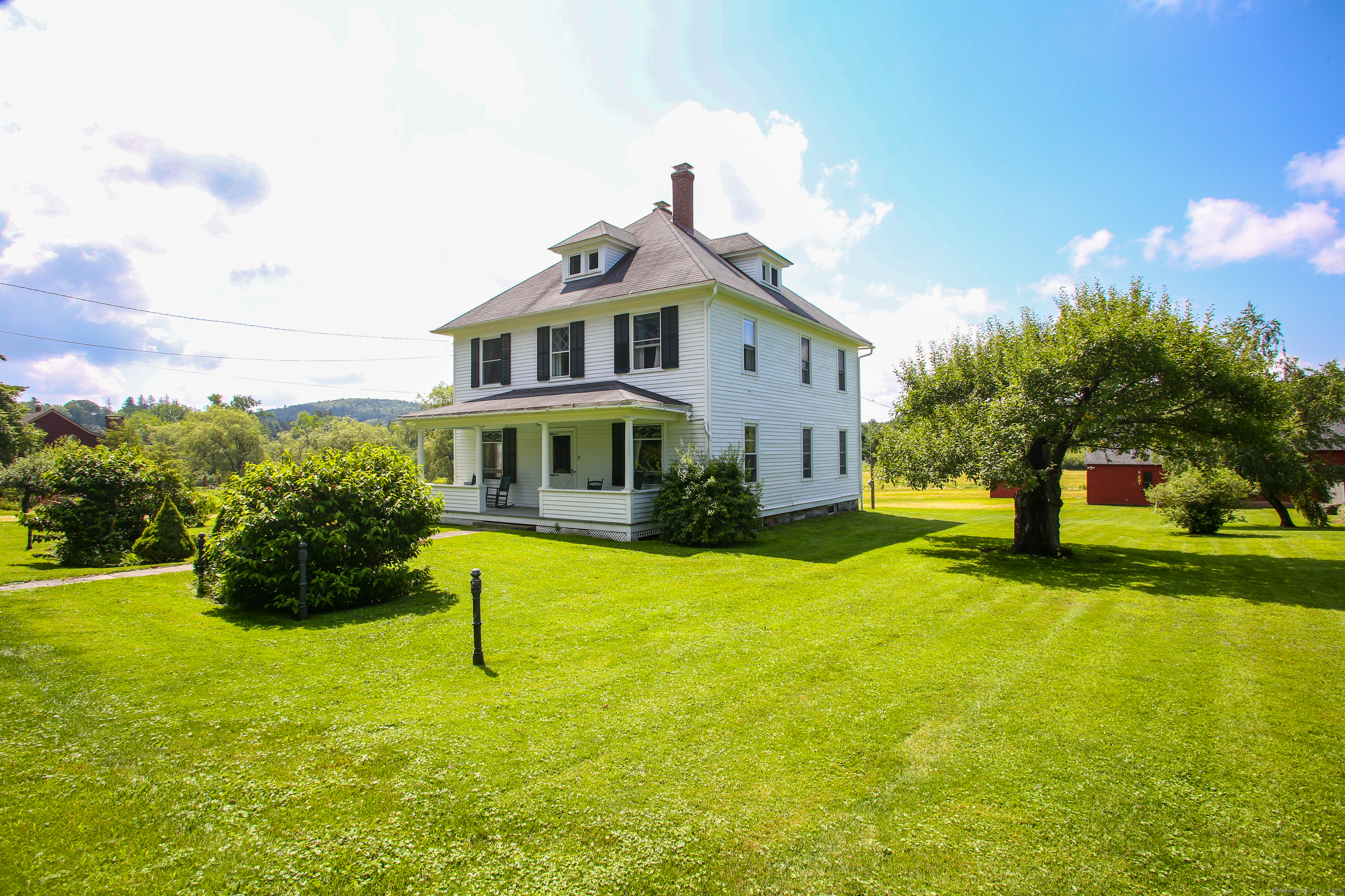 31 Sunset Ridge Road Norfolk, CT 06058 - Photo 3 of 33 a front view of a house with a yard