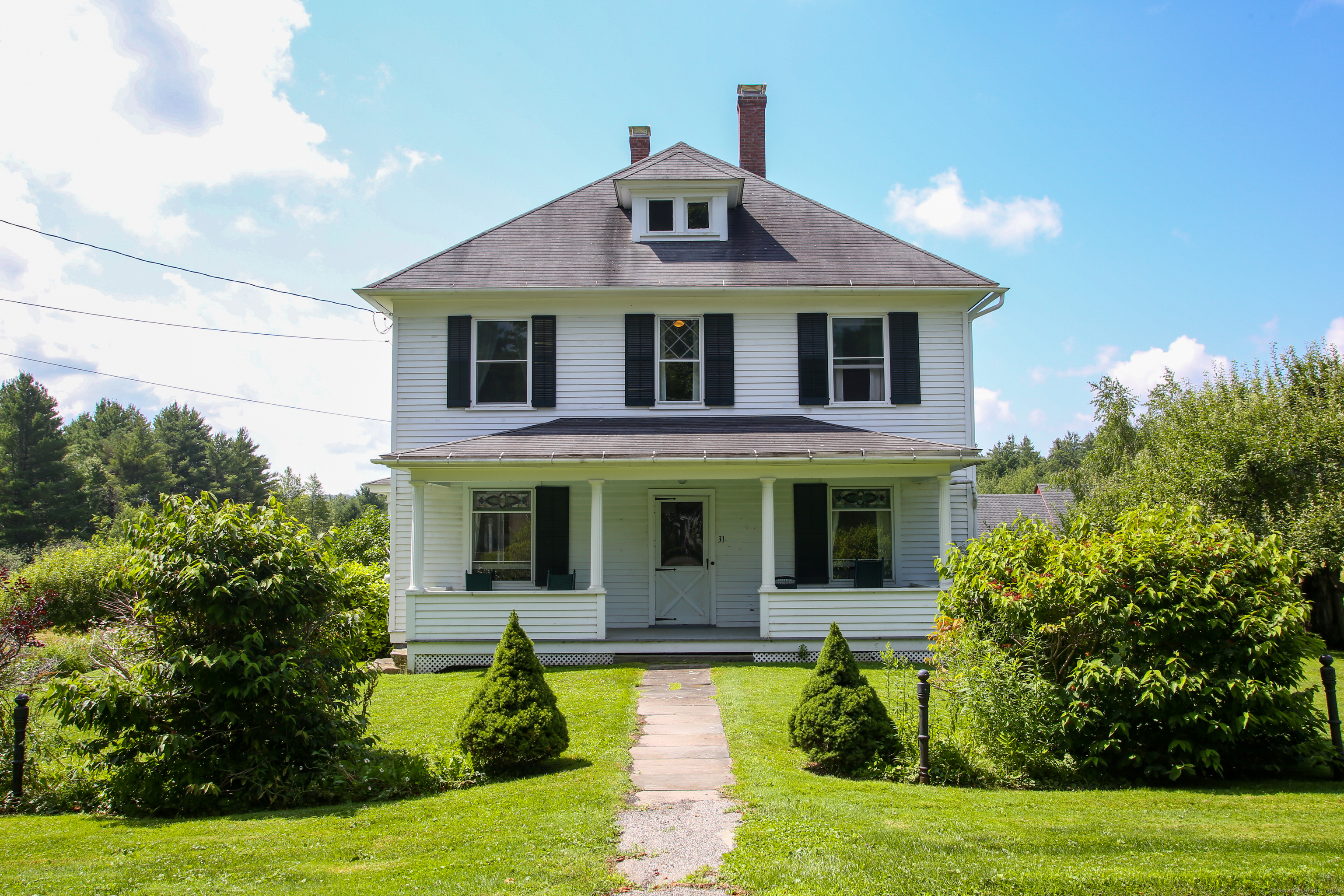 31 Sunset Ridge Road Norfolk, CT 06058 - Photo 4 of 33 a front view of a house with garden