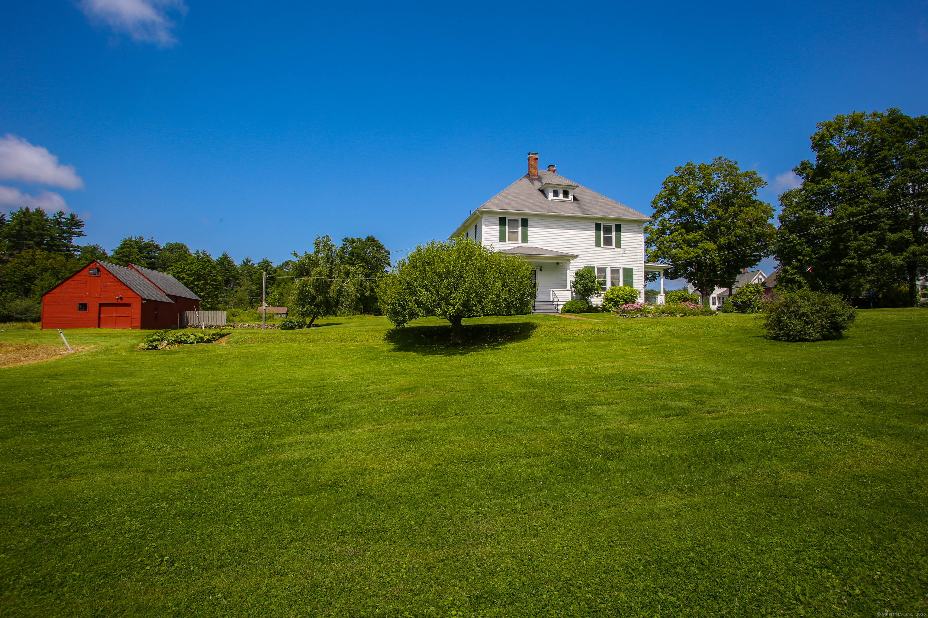 31 Sunset Ridge Road Norfolk, CT 06058 - Photo 5 of 33 a front view of a house with a yard