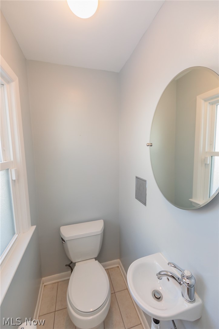 2444 Dysart Road Cleveland, OH 44118 - Photo 10 of 44 Bathroom featuring toilet, tile floors, and sink