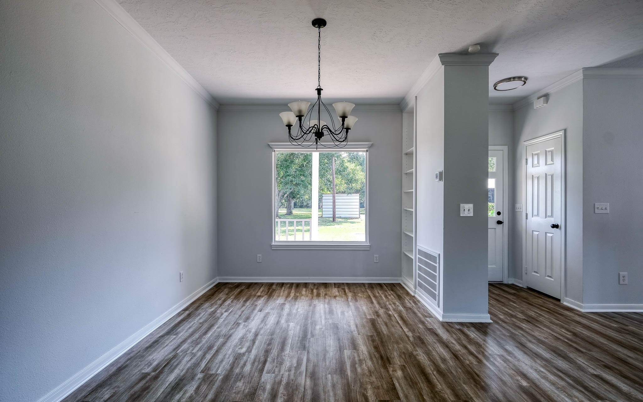 20515 Kickapoo Road Waller, TX 77484 - Photo 40 of 50 a view of a room with wooden floor exposed radiator and windows
