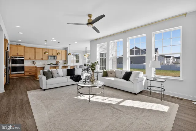 a view of a dining room with furniture and chandelier