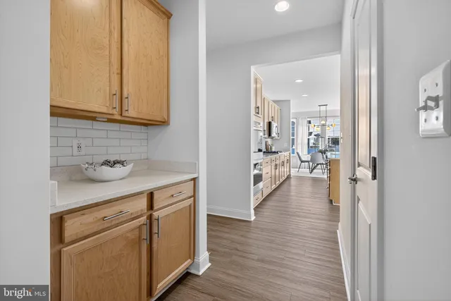 a living room with furniture and chandelier