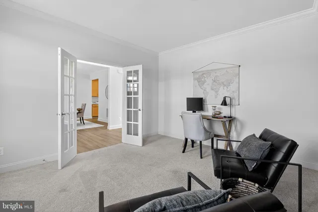 a bathroom with a tub a sink and a large mirror