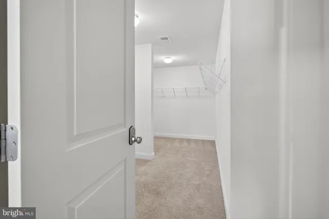 a view of a livingroom with a ceiling fan and window