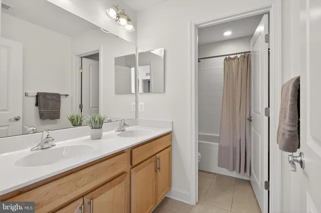 a view of a house with potted plants