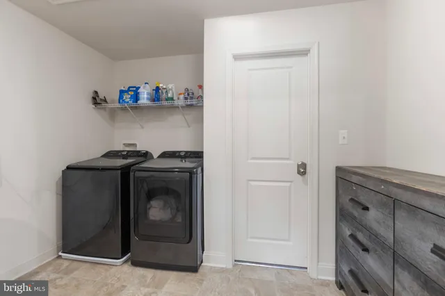 a aerial view of a house next to a yard