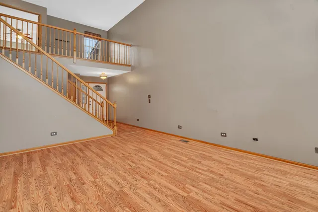 a view of an entryway with wooden floor