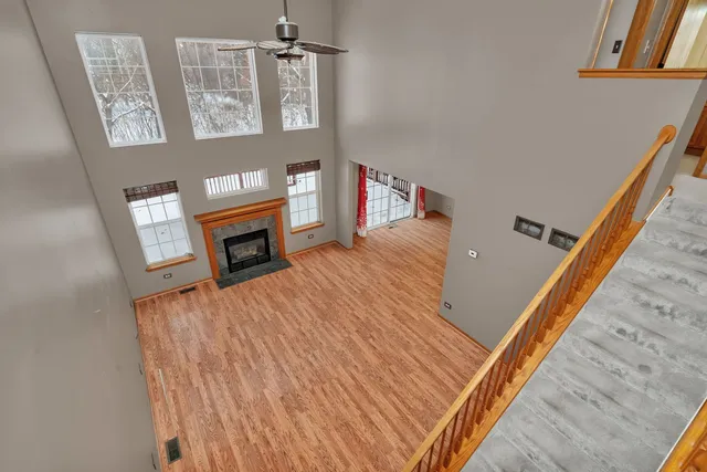 a view of a living room with furniture and a fireplace