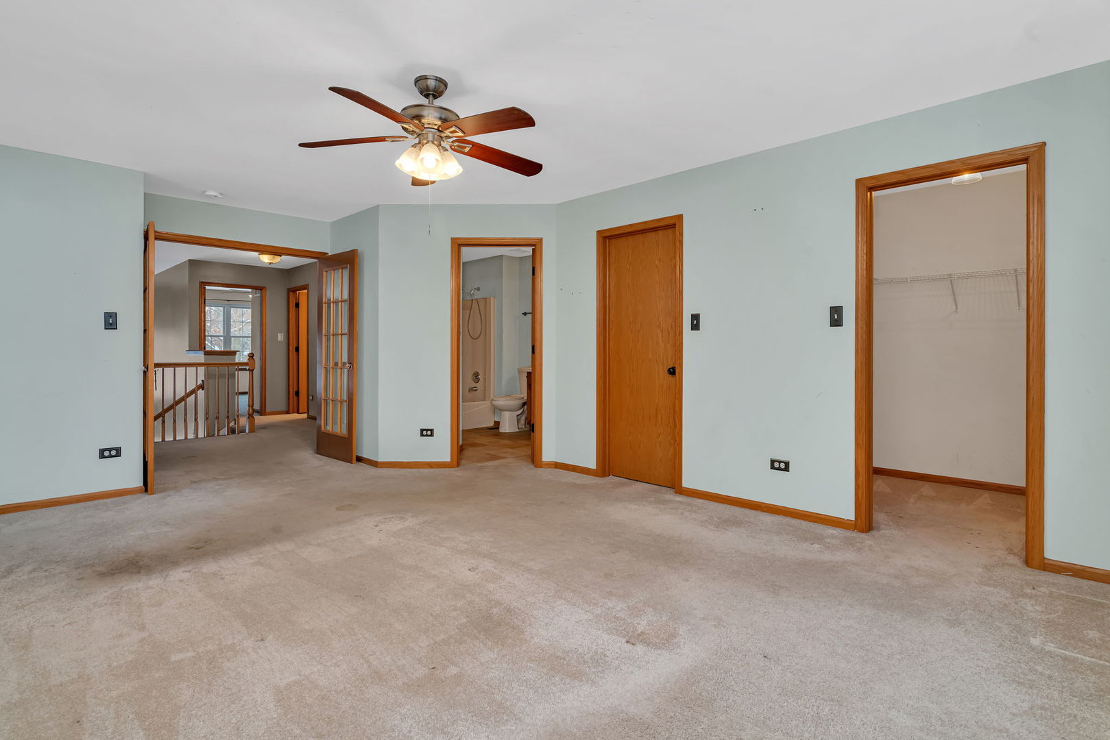 936 Treeline Court Lockport, IL 60441 - Photo 17 of 33 an empty room with ceiling fan and windows