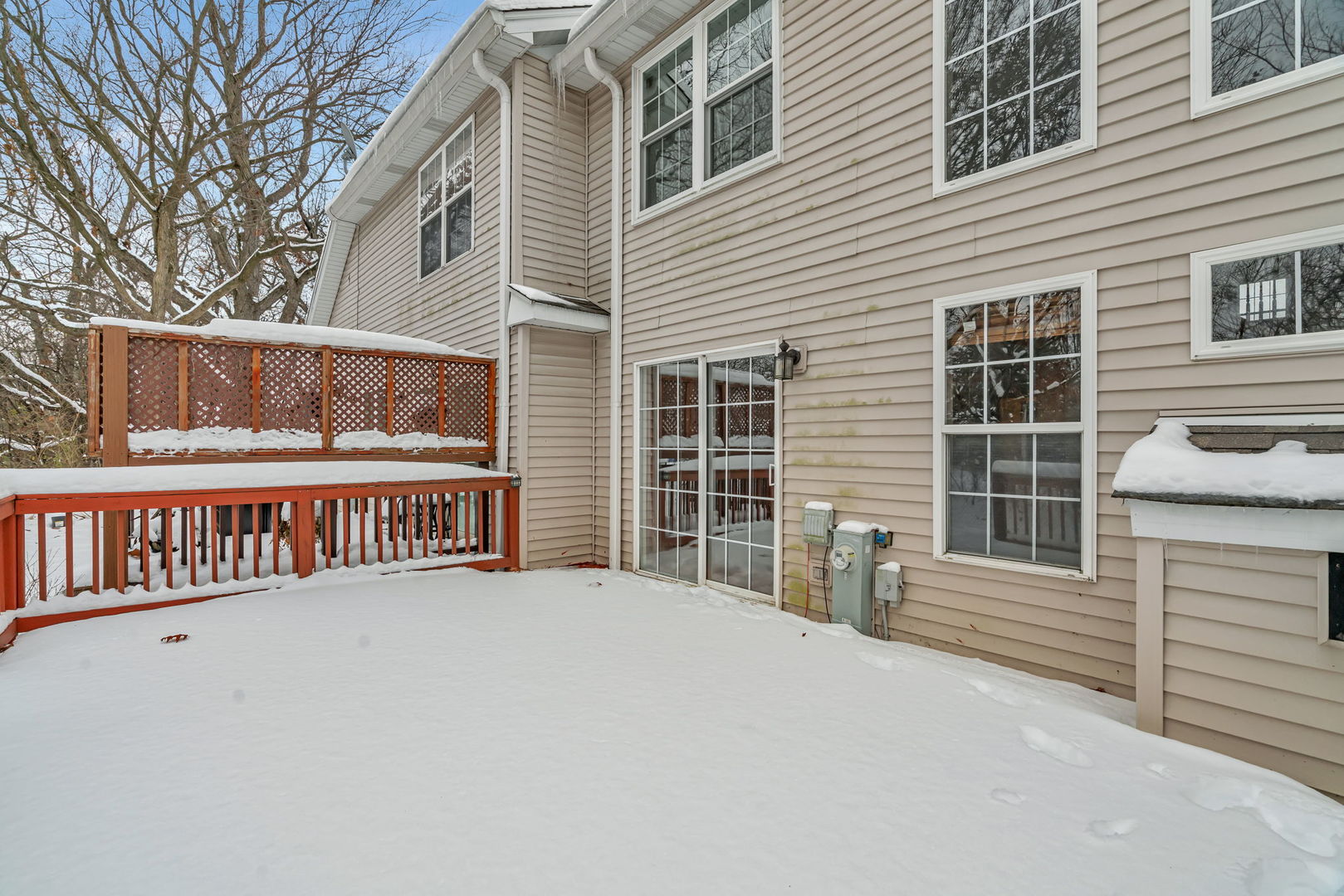 936 Treeline Court Lockport, IL 60441 - Photo 30 of 33 a view of a house with a large window and wooden fence