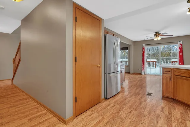 a view of hallway with wooden floor