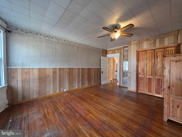 a view of a room with wooden walls