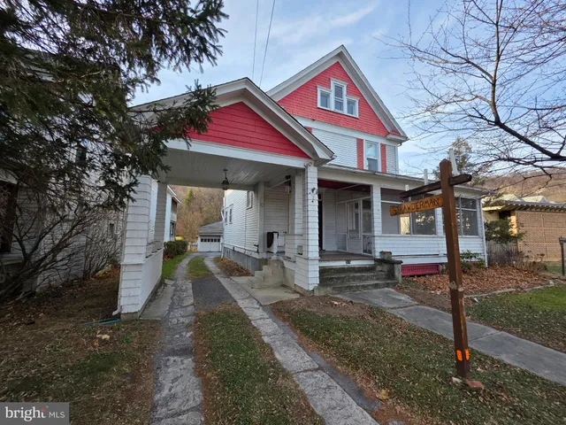 a view of walk in closet with clothes