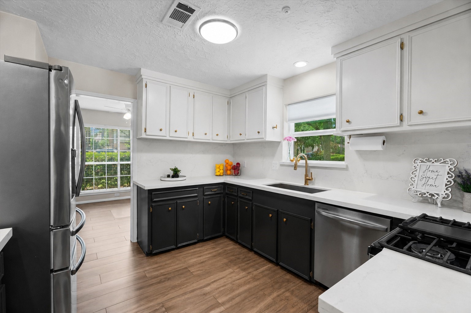 4026 Oxhill Road Spring, TX 77388 - Photo 12 of 40 Kitchen offers abundant cabinet storage, generous prep space, and a bright window above the farmhouse sink, creating a space that is both beautiful and highly functional.