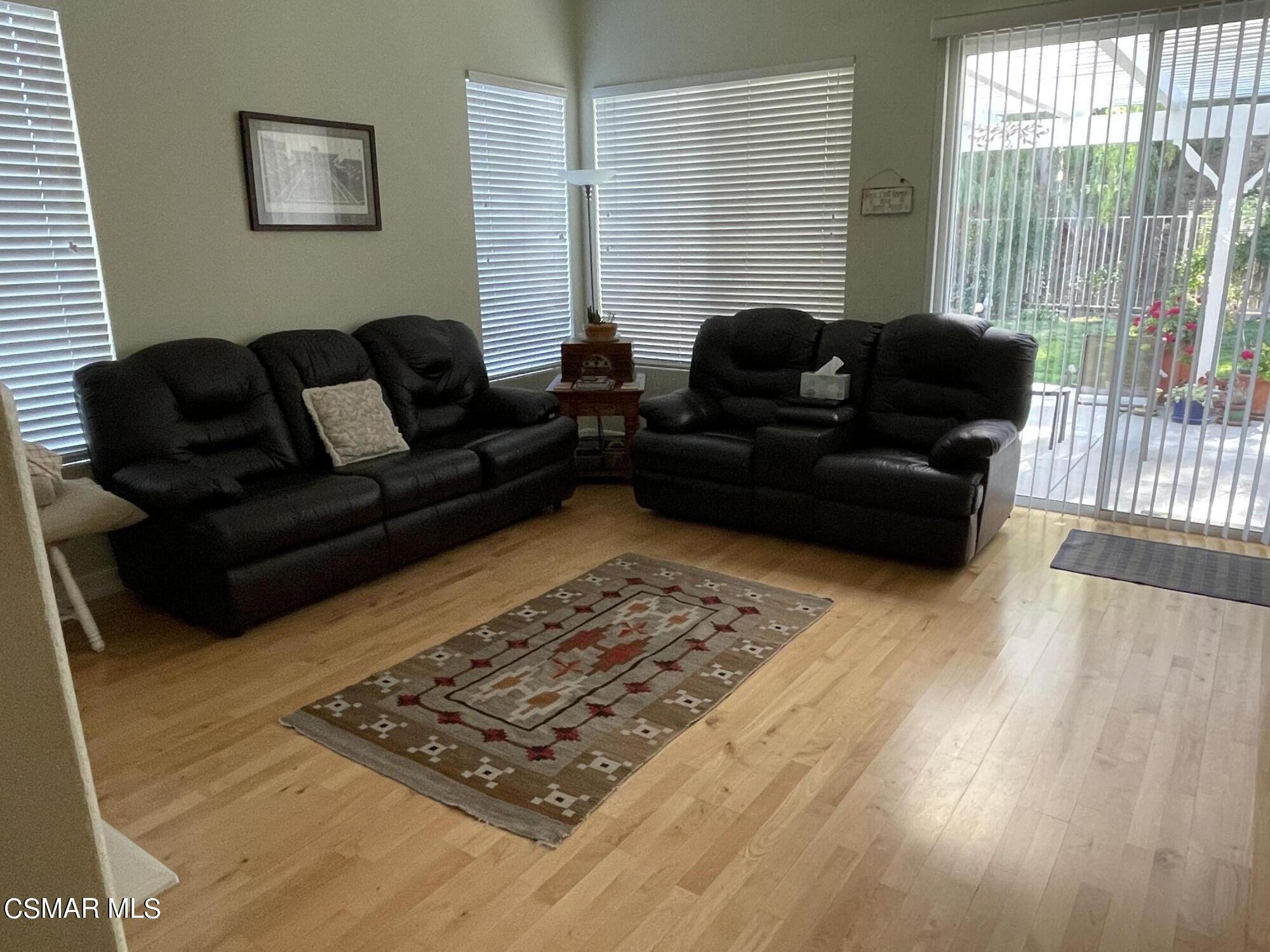 28587 Haskell Canyon Road Saugus, CA 91390 - Photo 11 of 26 a living room with furniture and a rug