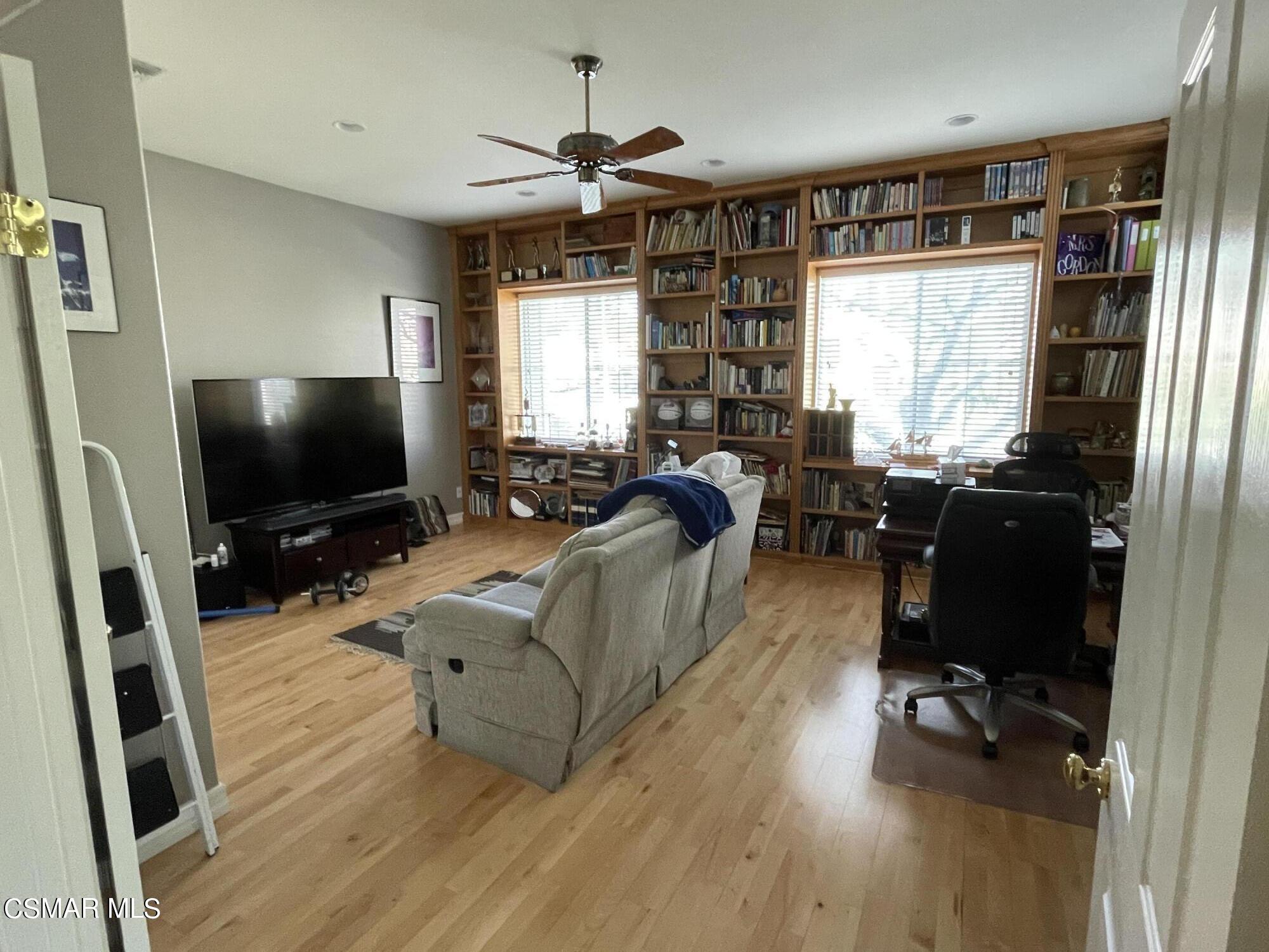 28587 Haskell Canyon Road Saugus, CA 91390 - Photo 13 of 26 a living room with furniture and a flat screen tv