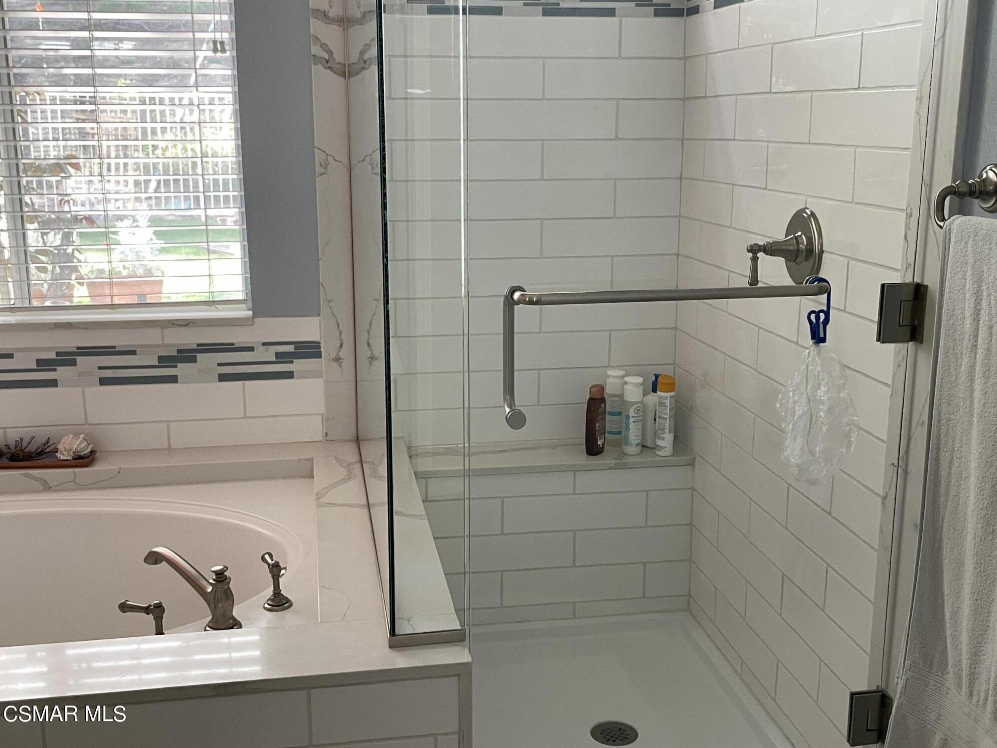 28587 Haskell Canyon Road Saugus, CA 91390 - Photo 15 of 26 a bathroom with a bathtub and a sink