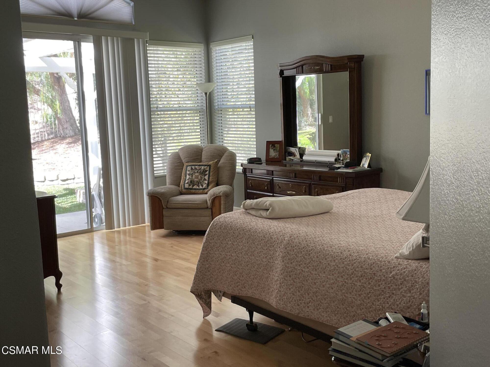 28587 Haskell Canyon Road Saugus, CA 91390 - Photo 16 of 26 a bedroom with furniture and a window