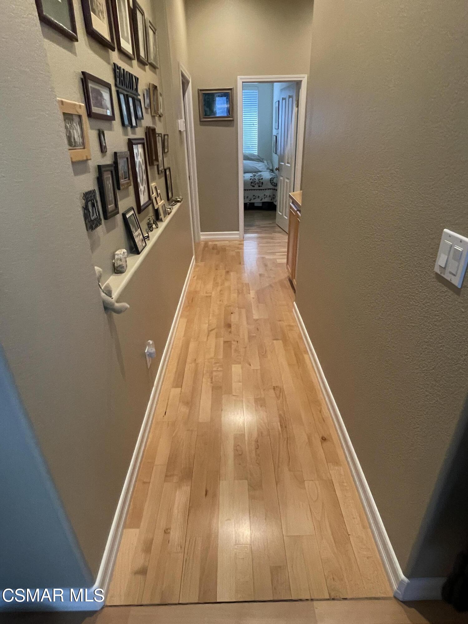 28587 Haskell Canyon Road Saugus, CA 91390 - Photo 20 of 26 a view of hallway with wooden floor