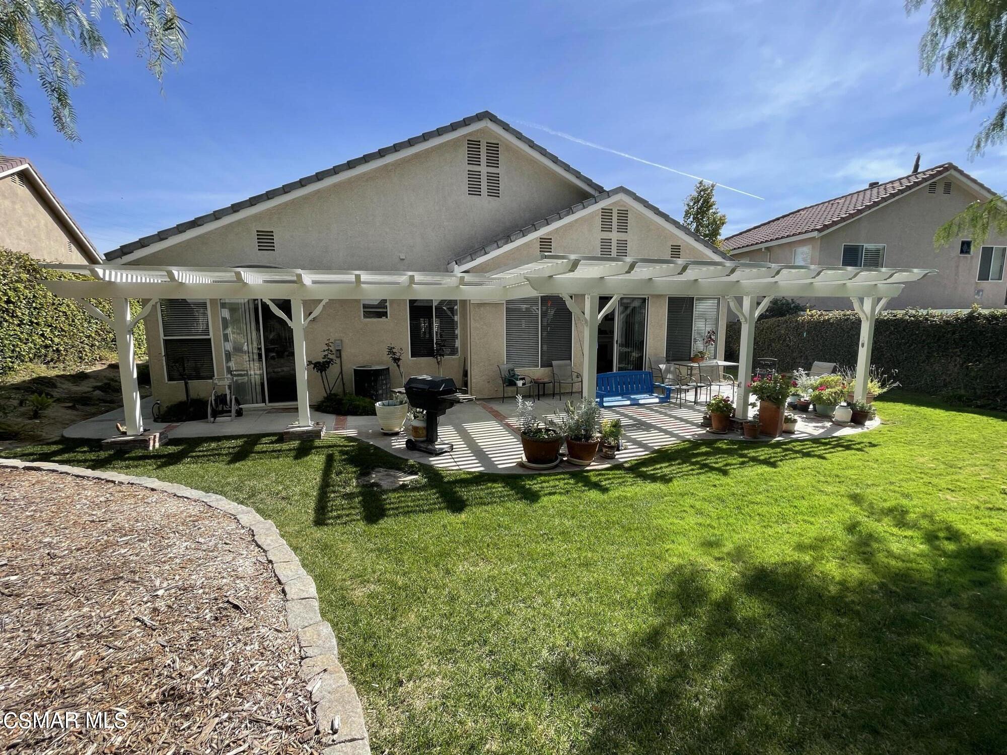 28587 Haskell Canyon Road Saugus, CA 91390 - Photo 25 of 26 a view of a house with backyard porch and sitting area