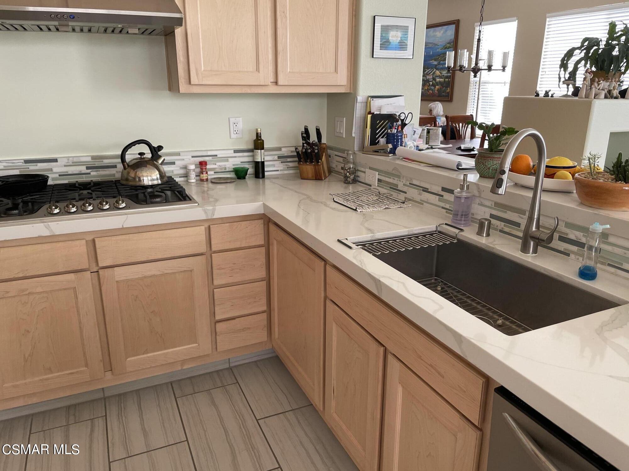 28587 Haskell Canyon Road Saugus, CA 91390 - Photo 5 of 26 a kitchen with a sink and cabinets